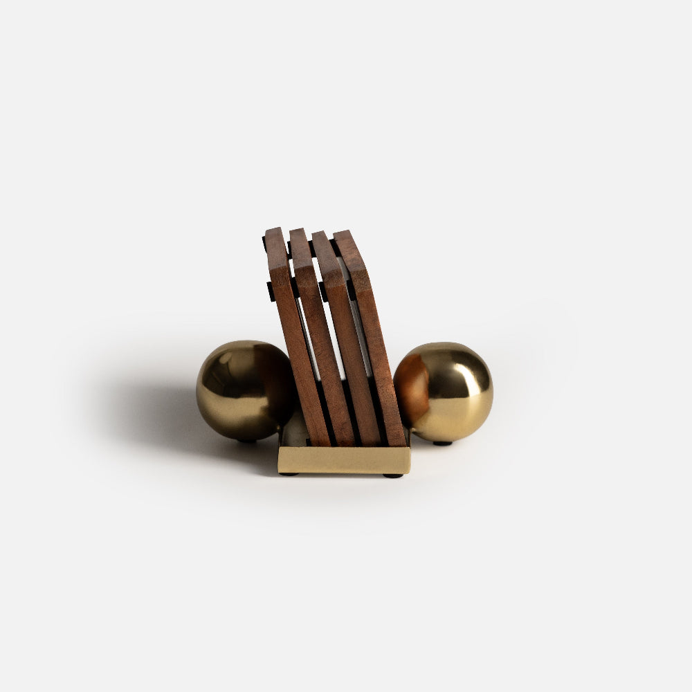 Wooden block with gold spheres on a white background