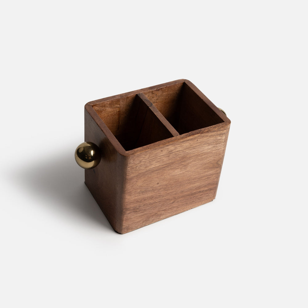 Wooden desk organizer with a gold ball on a white background