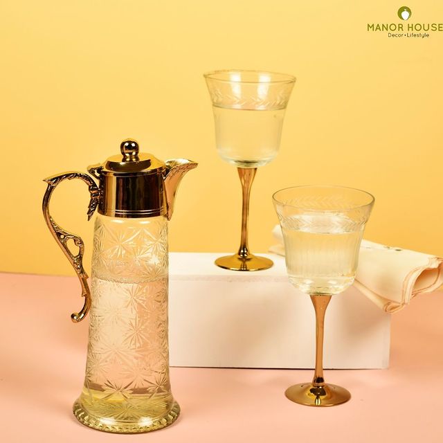 Have a luxe experience with this Neer Brass and Glass Jug and 2 Big Goblets Set