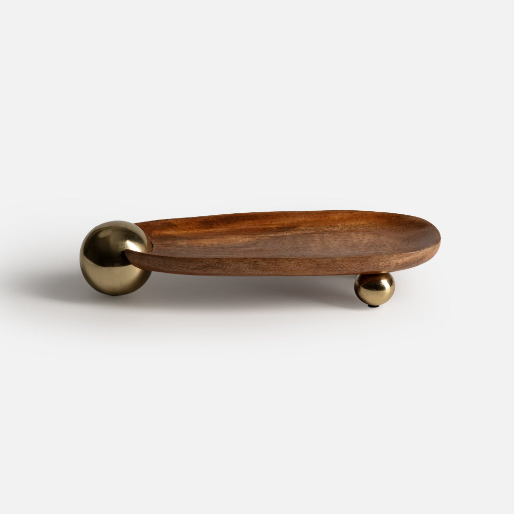 Wooden tray with brass accents on a white background