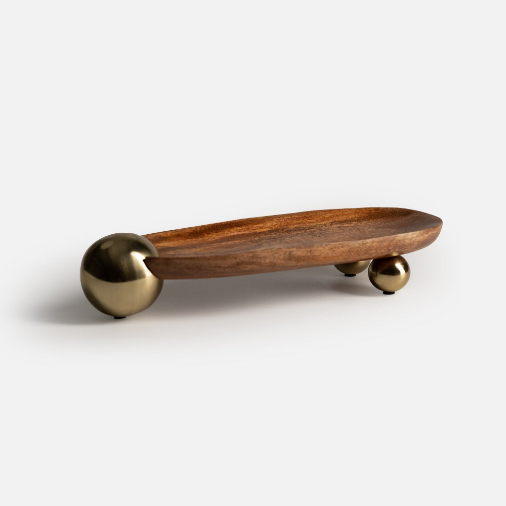 Wooden tray with brass handles on a white background